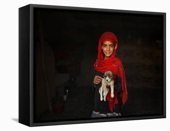 Girl Holds a Puppy as the Sun Sets over Kabul's Impoverished Teppe Maranjan Neighborhood-null-Framed Premier Image Canvas