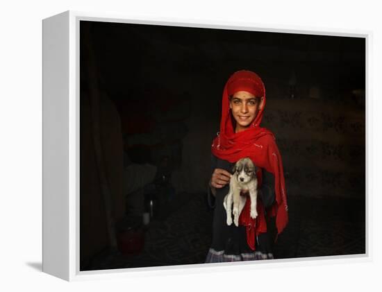 Girl Holds a Puppy as the Sun Sets over Kabul's Impoverished Teppe Maranjan Neighborhood-null-Framed Premier Image Canvas