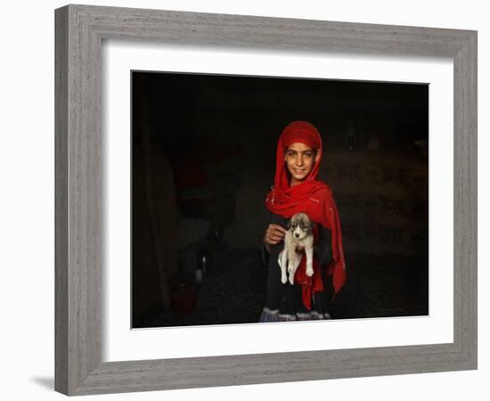 Girl Holds a Puppy as the Sun Sets over Kabul's Impoverished Teppe Maranjan Neighborhood-null-Framed Photographic Print