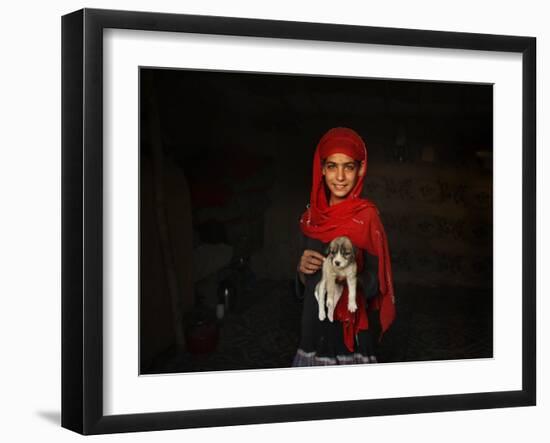 Girl Holds a Puppy as the Sun Sets over Kabul's Impoverished Teppe Maranjan Neighborhood-null-Framed Photographic Print