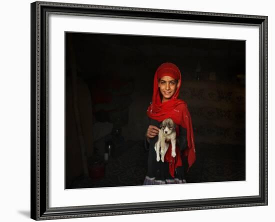 Girl Holds a Puppy as the Sun Sets over Kabul's Impoverished Teppe Maranjan Neighborhood-null-Framed Photographic Print