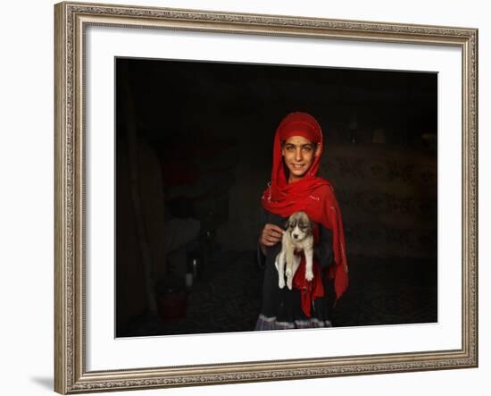 Girl Holds a Puppy as the Sun Sets over Kabul's Impoverished Teppe Maranjan Neighborhood-null-Framed Photographic Print