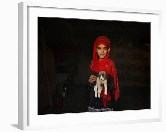 Girl Holds a Puppy as the Sun Sets over Kabul's Impoverished Teppe Maranjan Neighborhood-null-Framed Photographic Print