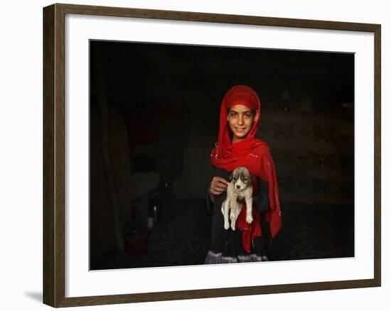 Girl Holds a Puppy as the Sun Sets over Kabul's Impoverished Teppe Maranjan Neighborhood-null-Framed Photographic Print