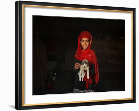 Girl Holds a Puppy as the Sun Sets over Kabul's Impoverished Teppe Maranjan Neighborhood-null-Framed Photographic Print