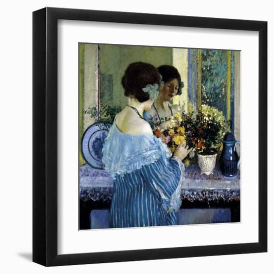 Girl in Blue Arranging Flowers, c1915-Frederick Carl Frieseke-Framed Premium Giclee Print