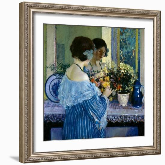 Girl in Blue Arranging Flowers (Oil on Canvas)-Frederick Carl Frieseke-Framed Giclee Print