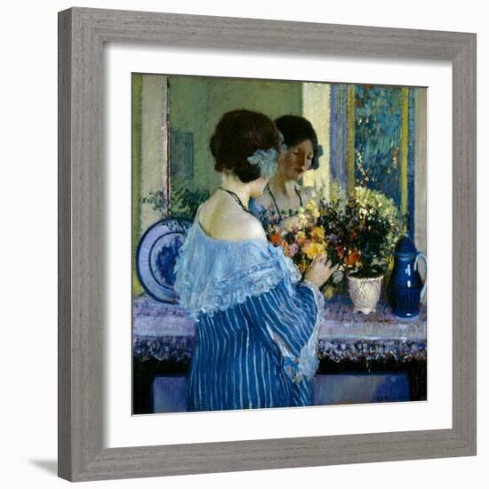 Girl in Blue Arranging Flowers (Oil on Canvas)-Frederick Carl Frieseke-Framed Giclee Print