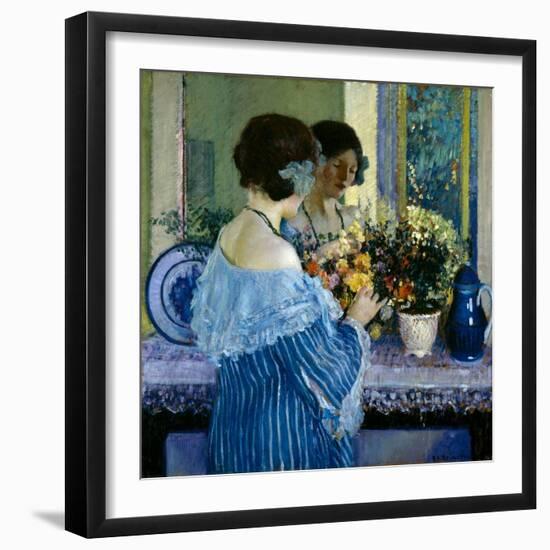 Girl in Blue Arranging Flowers (Oil on Canvas)-Frederick Carl Frieseke-Framed Giclee Print