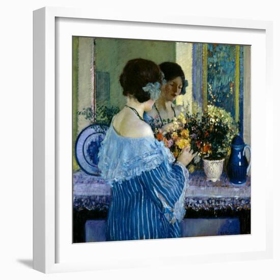 Girl in Blue Arranging Flowers (Oil on Canvas)-Frederick Carl Frieseke-Framed Giclee Print