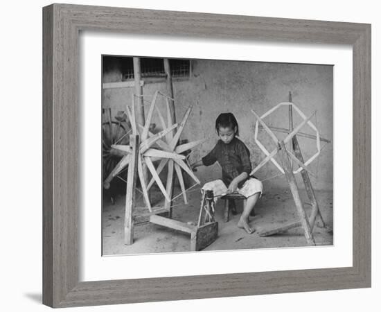 Girl Making Thread For Weaving-Carl Mydans-Framed Photographic Print