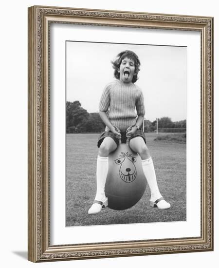 Girl on a space hopper, 1970s-Tony Boxall-Framed Photographic Print