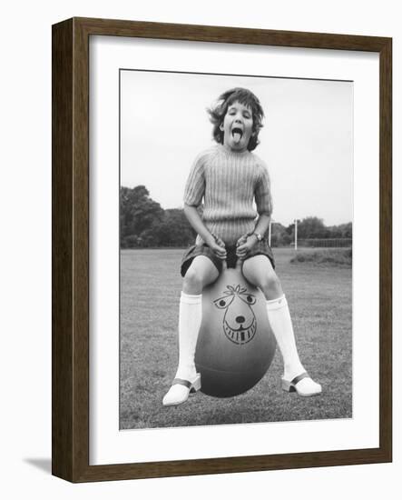 Girl on a space hopper, 1970s-Tony Boxall-Framed Photographic Print