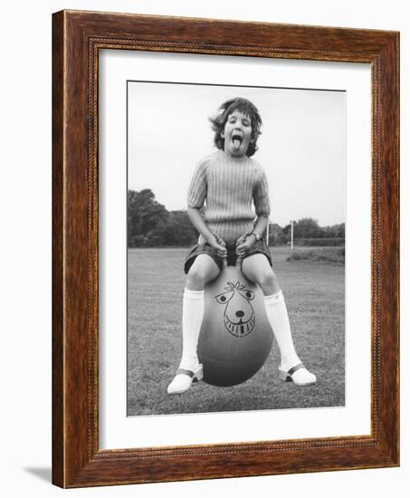 Girl on a space hopper, 1970s-Tony Boxall-Framed Photographic Print