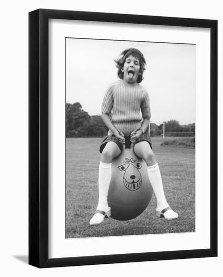 Girl on a space hopper, 1970s-Tony Boxall-Framed Photographic Print