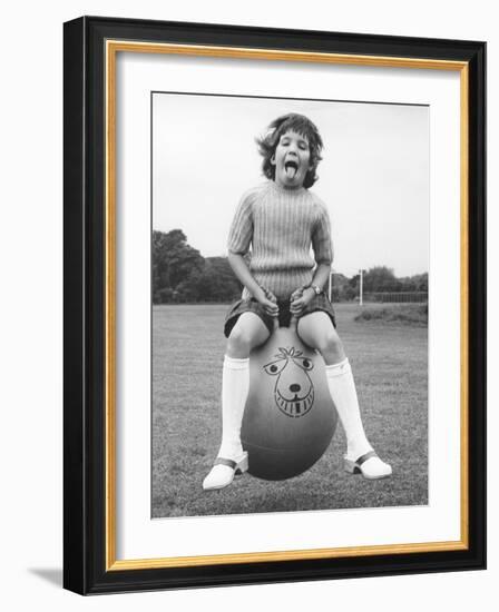 Girl on a space hopper, 1970s-Tony Boxall-Framed Photographic Print