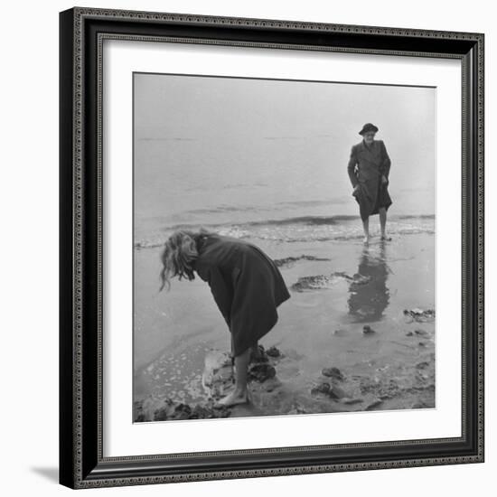 Girl Playing in the Sand while an Older Woman Gets Her Feet Wet in the Ocean at Blackpool Beach-Ian Smith-Framed Photographic Print