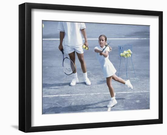 Girl Playing Tennis Under Supervision of a Coach-null-Framed Photographic Print