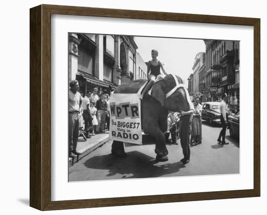 Girl Riding Elephant as a Publicity Stunt for a Radio Station-Peter Stackpole-Framed Photographic Print