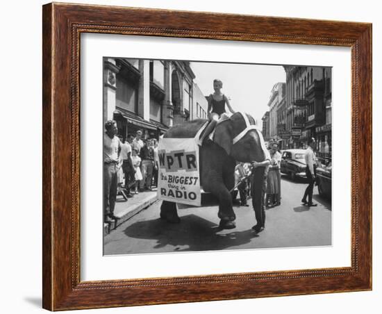 Girl Riding Elephant as a Publicity Stunt for a Radio Station-Peter Stackpole-Framed Photographic Print