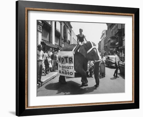 Girl Riding Elephant as a Publicity Stunt for a Radio Station-Peter Stackpole-Framed Photographic Print