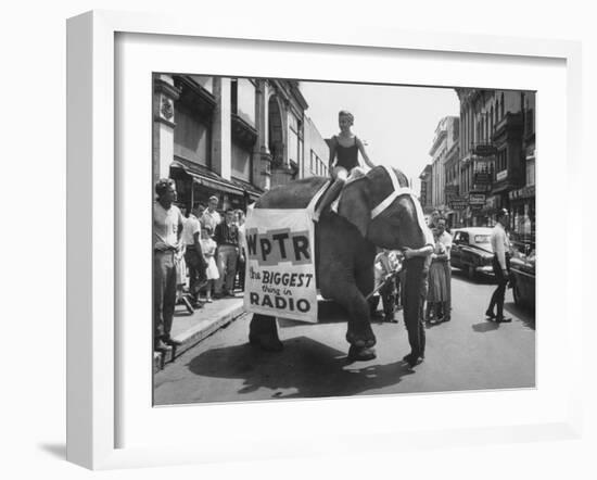 Girl Riding Elephant as a Publicity Stunt for a Radio Station-Peter Stackpole-Framed Photographic Print
