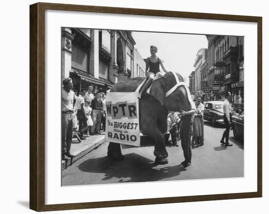 Girl Riding Elephant as a Publicity Stunt for a Radio Station-Peter Stackpole-Framed Photographic Print