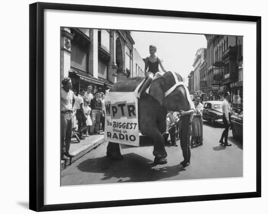 Girl Riding Elephant as a Publicity Stunt for a Radio Station-Peter Stackpole-Framed Photographic Print
