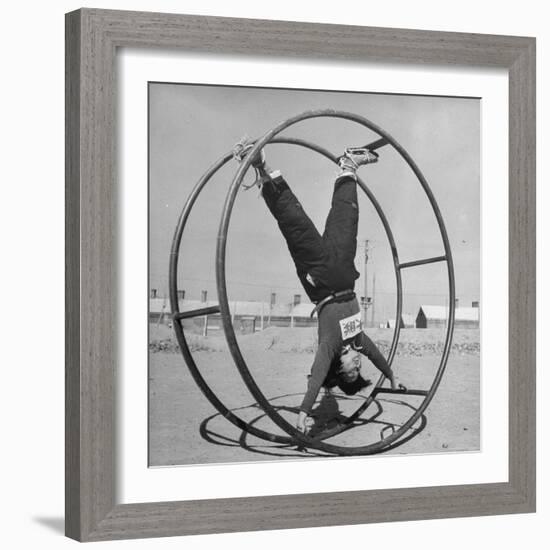 Girl Rolling in Large Wheel During Physical Education Class at North China Union University-George Lacks-Framed Photographic Print