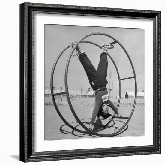 Girl Rolling in Large Wheel During Physical Education Class at North China Union University-George Lacks-Framed Photographic Print