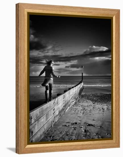 Girl Walking on Sea Defence-Rory Garforth-Framed Premier Image Canvas