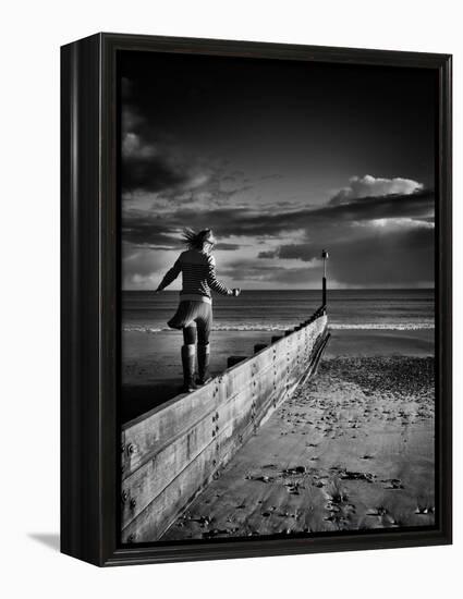 Girl Walking on Sea Defence-Rory Garforth-Framed Premier Image Canvas