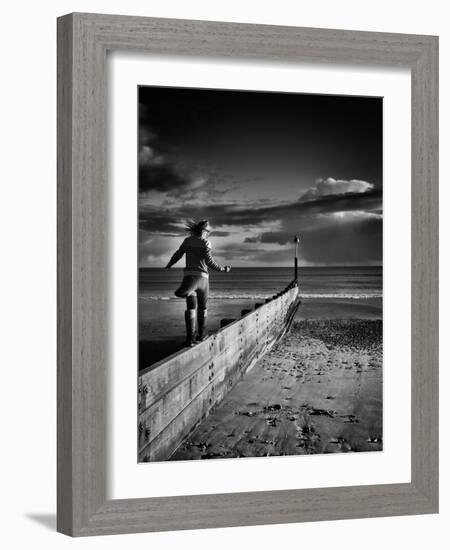 Girl Walking on Sea Defence-Rory Garforth-Framed Photographic Print