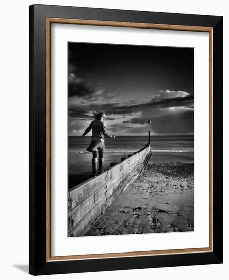 Girl Walking on Sea Defence-Rory Garforth-Framed Photographic Print