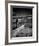 Girl Walking on Sea Defence-Rory Garforth-Framed Photographic Print