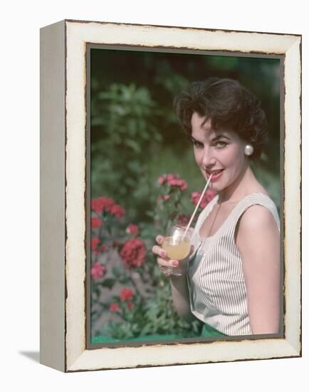 Girl with Britvic Glass-Charles Woof-Framed Premier Image Canvas