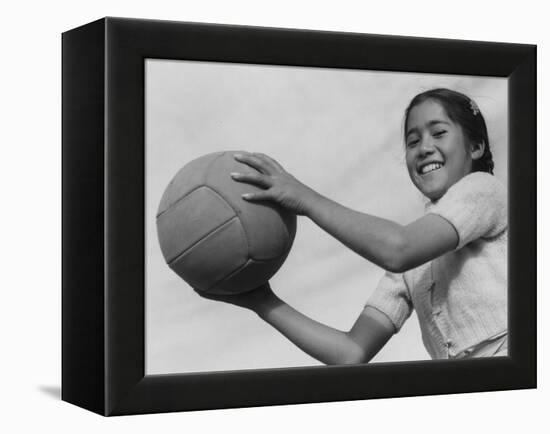 Girl with volley ball, Manzanar Relocation Center, 1943-Ansel Adams-Framed Premier Image Canvas