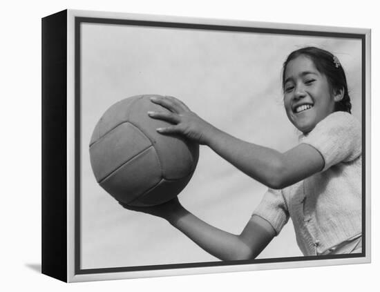 Girl with volley ball, Manzanar Relocation Center, 1943-Ansel Adams-Framed Premier Image Canvas