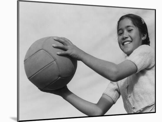 Girl with volley ball, Manzanar Relocation Center, 1943-Ansel Adams-Mounted Photographic Print