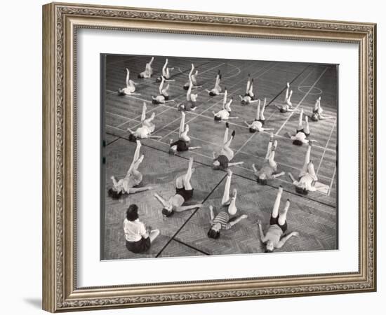 Girls and Women Doing Leg Exercise on Floor of Metropolitan Life Insurance Company's Gym-Herbert Gehr-Framed Photographic Print