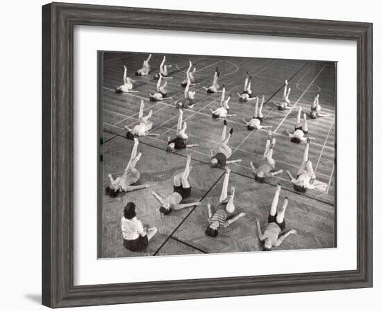 Girls and Women Doing Leg Exercise on Floor of Metropolitan Life Insurance Company's Gym-Herbert Gehr-Framed Photographic Print