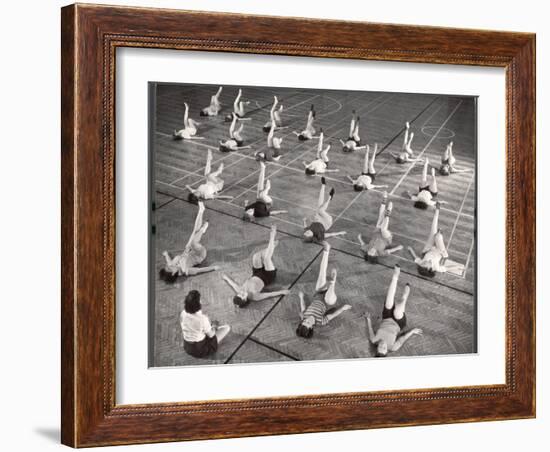 Girls and Women Doing Leg Exercise on Floor of Metropolitan Life Insurance Company's Gym-Herbert Gehr-Framed Photographic Print