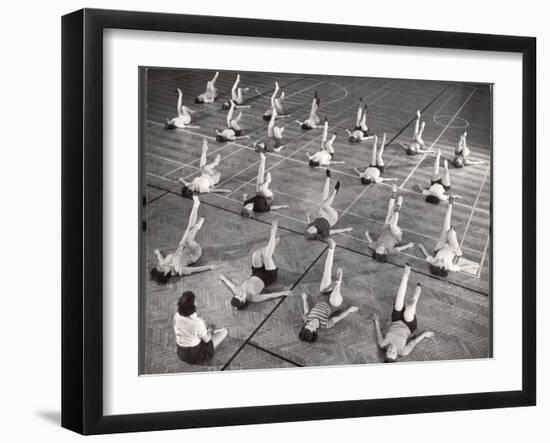 Girls and Women Doing Leg Exercise on Floor of Metropolitan Life Insurance Company's Gym-Herbert Gehr-Framed Photographic Print