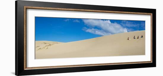 Girls getting ready to slide down the Te Paki Sand Dunes, Cape Reinga, Northland Region, North I...-null-Framed Photographic Print