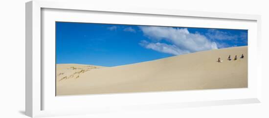 Girls getting ready to slide down the Te Paki Sand Dunes, Cape Reinga, Northland Region, North I...-null-Framed Photographic Print