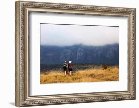 Girls hiking on a trail, Andringitra National Park, Ambalavao, central area, Madagascar, Africa-Christian Kober-Framed Photographic Print