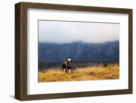 Girls hiking on a trail, Andringitra National Park, Ambalavao, central area, Madagascar, Africa-Christian Kober-Framed Photographic Print