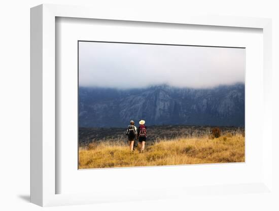 Girls hiking on a trail, Andringitra National Park, Ambalavao, central area, Madagascar, Africa-Christian Kober-Framed Photographic Print