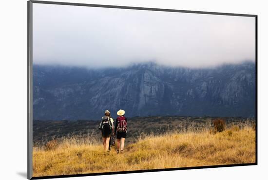 Girls hiking on a trail, Andringitra National Park, Ambalavao, central area, Madagascar, Africa-Christian Kober-Mounted Photographic Print