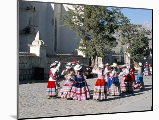 Girls in Traditional Local Dress Dancing in Square at Yanque Village, Colca Canyon, Peru-Tony Waltham-Mounted Photographic Print